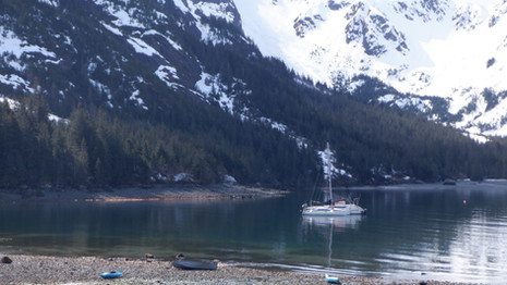 Siren in a mountain-lined anchorage